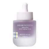 Beekman 1802 Dream Booster serum bottle on a shelf, fragrance-free formula ready for nightly use.