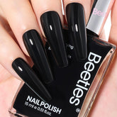 Beetles Black Nail Polish Quick Dry bottle delivers a glossy, fast-drying finish for at-home manicures.