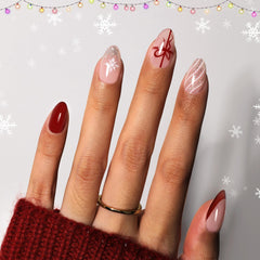 Beetles Gel Polish Christmas nails with bow design for festive manicure