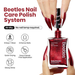 Beetles red glitter swirl on nails for a festive shimmer.