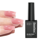 Beetles Nude Pink gel polish bottle close-up showing translucent jelly finish for natural nails.