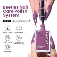 Beetles purple nail polish brush close-up showing smooth application.