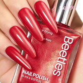Beetles Red Nail Polish bottle with quick-dry glitter for effortless at-home manicures.