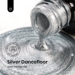 Beetles Silver Gel Polish glitter close-up highlights sparkle for festive looks.