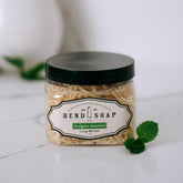 Bend Soap Company Eucalyptus Spearmint Milk Bath bottle pour shows calming aroma and gentle cleanse.