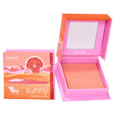 Benefit Sunny Warm Coral Blush compact close-up, rich color for radiant cheeks.