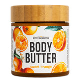 Better Shea Butter Sweet Orange Body Butter in a jar, hydrating dry skin.