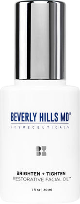 Beverly Hills MD Brighten + Tighten oil bottle on a clean vanity for premium daily care.