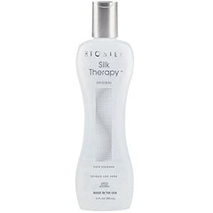 BioSilk Silk Therapy Original Cure Conditioner creamy formula on palm for easy application.