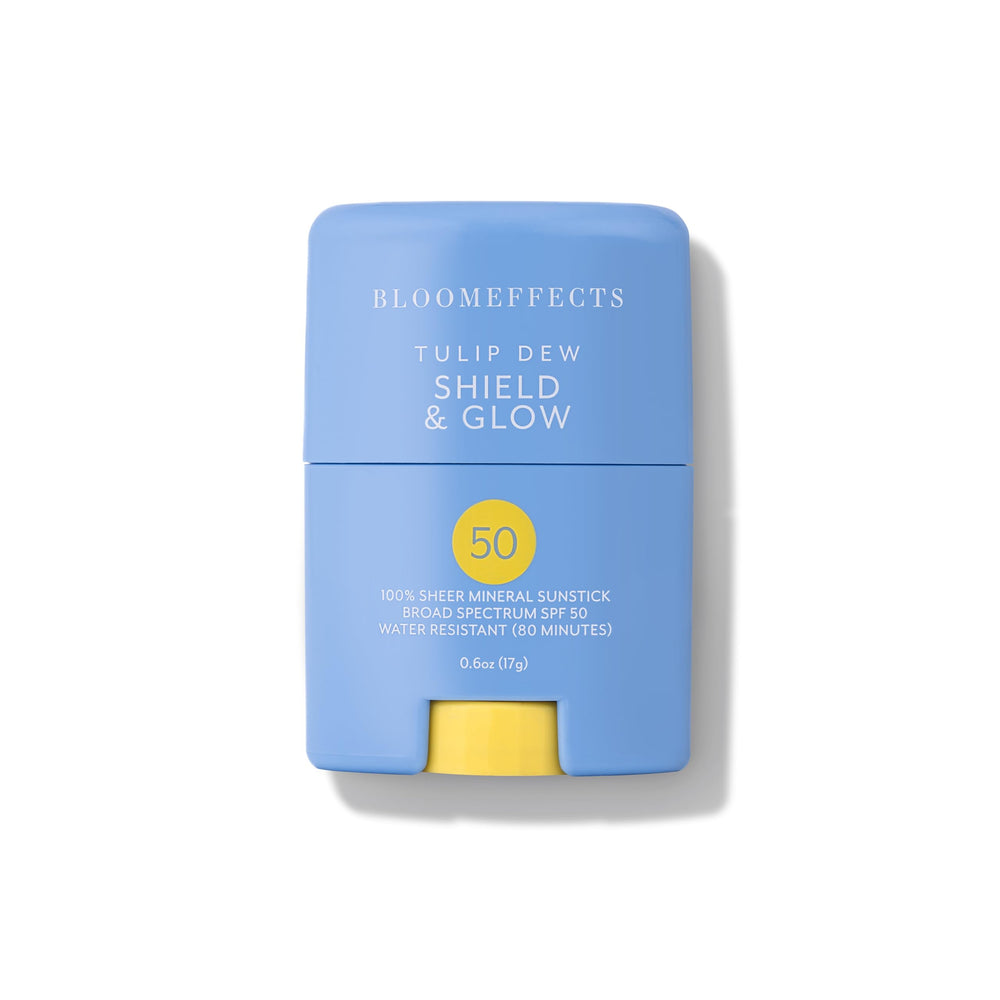 Bloomeffects Tulip Dew Shield Sunstick bottle in use delivering sheer mineral protection