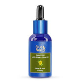 Blue Nectar Nabhi oil bottle ready for daily belly oil ritual promoting skin hydration.