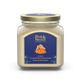 Blue Nectar turmeric ubtan powder pack enhances gentle exfoliation for radiant skin.