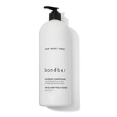 Bondbar conditioner bottle on display signaling bond repair and moisturizing protection.