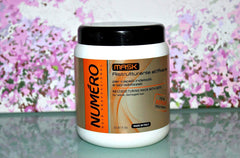 Applying Brelil Numero oat mask to wet hair for deep conditioning