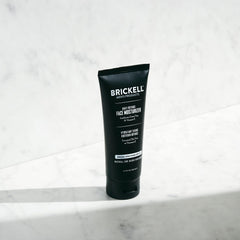 Close-up of Brickell Daily Defense texture showing light, oil-free formula.