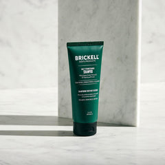 Brickell Daily Strengthening Shampoo lather close-up showing fuller-looking hair and invigorating sensation.