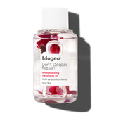 Briogeo Don't Despair, Repair! oil bottle pour showing sealing split ends and improved manageability