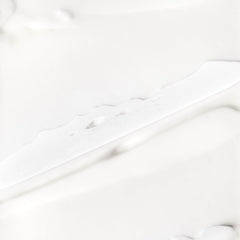 Close-up of Briogeo Farewell Frizz label, signaling silicone-free, cruelty-free care.