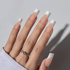 BTArtboxnails long square nude nail tips close-up for natural-looking extensions.