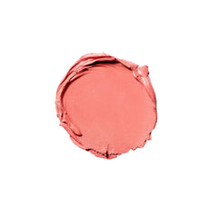 Close-up of creamy coral sheer texture swirled for a diffused, buildable glow on skin