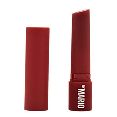 BY MARIO MoistureGlow Lip Serum swatch shows sheer berry tone.