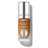 By Terry Brightening CC Foundation glow bottle highlights radiant skin with a lightweight finish.