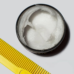 BYRD Pomade easy application—scoop, rub, and style