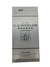 C.O. Bigelow Elixir Black bottle being poured for a premium evening fragrance.