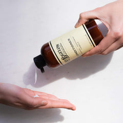 C.O. Bigelow Lavender Peppermint Conditioner lavender flowers beside bottle for soothing scent