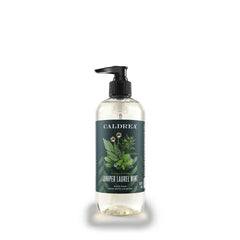 Caldrea hand soap bottle showing aloe, olive oil, and mint aroma for gentle cleansing.