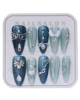 CAMILCY Almond Catseye nails with blue diamonds for a salon look at home