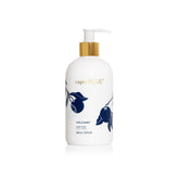Capri Blue Volcano hand wash bottle enhances sink with vibrant design.