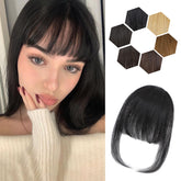 Carendia clip-in bangs in natural black wispy front for instant face framing.