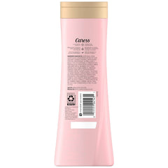 Caress body wash bottle close-up highlighting hydrating formula for silky skin.