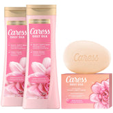 Caress Daily Silk bundle packaging showing two washes and one bar soap for a complete routine.