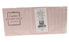 Cartier Baiser Vole sample pack with twelve travel-size vials for testing.
