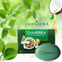 Chandrika soap packaging on warm wood emphasizing natural ingredients