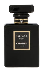 CHANEL Coco Noir bottle closeup showing a sleek black design for refined nights