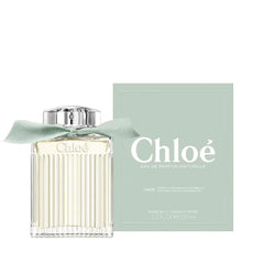 Chloe Naturelle packaging and cedar base shot, suggesting a warm woody finish for evening wear.