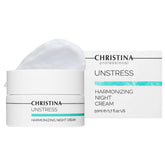 CHRISTINA Unstress Harmonizing Night Cream bottle demonstrates hydration and renewal for dry, aging skin.