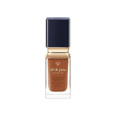Clé de Peau Beauté Radiant Fluid Foundation bottle shows hydrating finish and 24-hour wear