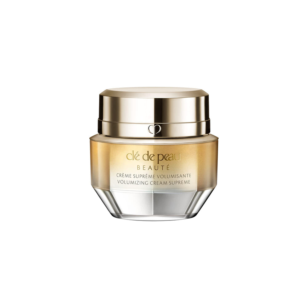 Clé de Peau Beauté mini volumizing cream supreme bottle application shows premium texture and easy daily use.