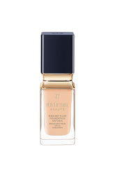 Clé de Peau Radiant Fluid Foundation bottle close-up for luminous, hydrated skin.