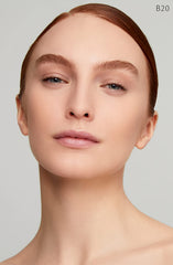 Clé de Peau Radiant Fluid Foundation packaging closeup with cap and gold accent