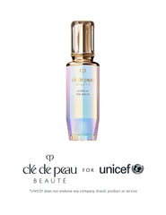 Clé de Peau The Serum swirl highlights Radiant Lily Concentrate for brightness.