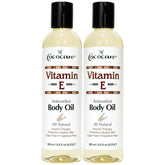 COCOCARE Vitamin E body oil bottle at an angle highlighting hydration for all skin types.