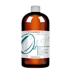 Cocojojo Organic Vitamin E Oil bottle shows pure, cold-pressed almond oil for skin nourishment.