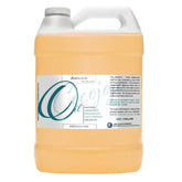 cocojojo Pure Deodorized Argan Oil 1-gallon bottle with a golden glow for skin and hair care.