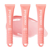 Cocokind Ceramide Lip Blur Balm in coral pink for hydrating lips and subtle shine.