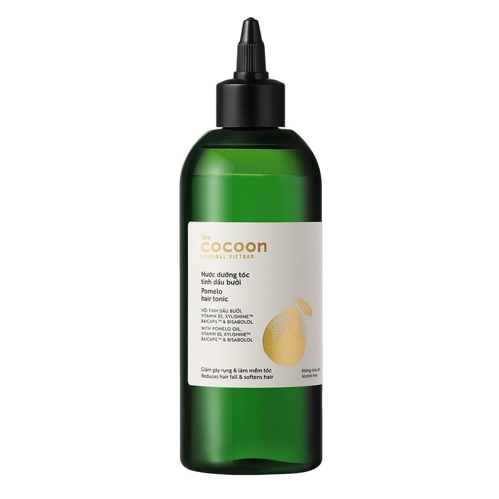 Cocoon Original Pomelo Oil Hair Tonic bottle with pour for easy scalp application.